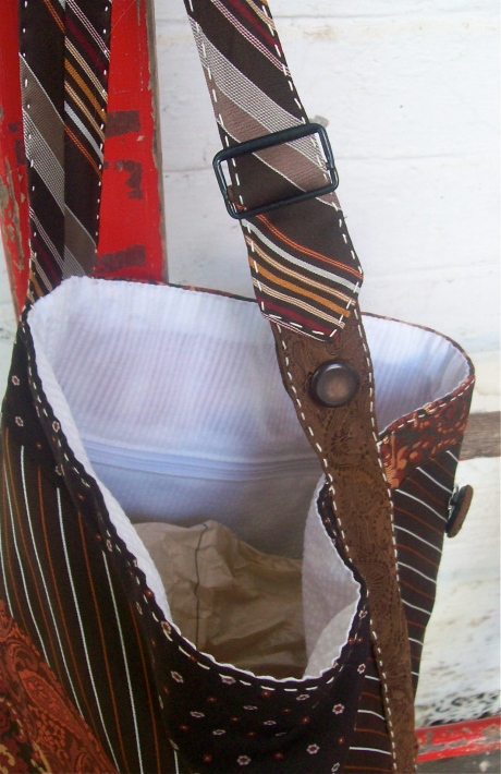 An alternative strap with buckle and a self pocket with zipper on the inside.